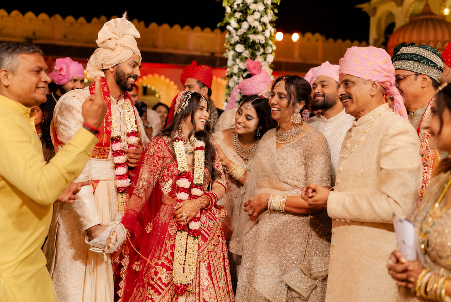 Indian couple honoring family traditions at a modern Rajasthan destination wedding